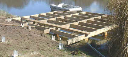 Deck framework, part over water part over land.