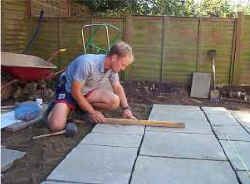 Shhh, concentration needed when laying a patio